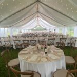 outdoor tented wedding with draping and twinkle lights